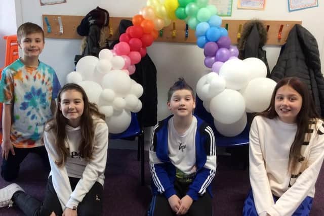 Hardingstone Academy pupils with an impressive balloon rainbow. Photo: East Midlands Academy Trust