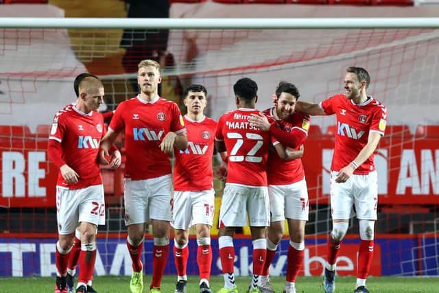 Chartlon celebrate Connor Washington putting them ahead from the penalty spot