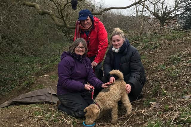 The relieved owners with Barney the dog after he escaped from the badger sett in Northampton. Photo: Northamptonshire Badger Group
