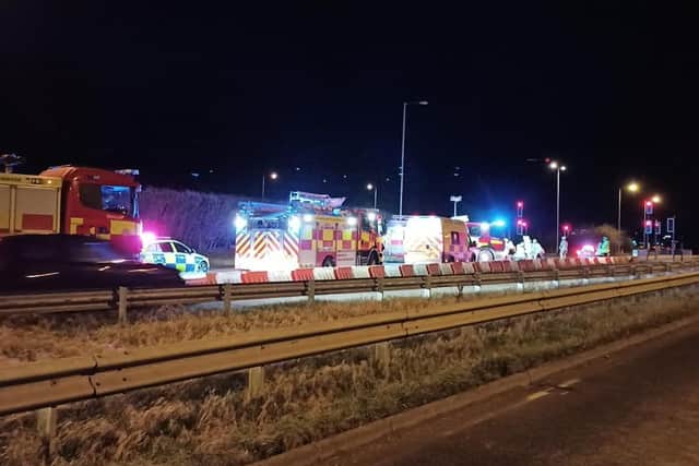 Multiple emergency services are at the scene trying to cut loose the passenger(s)