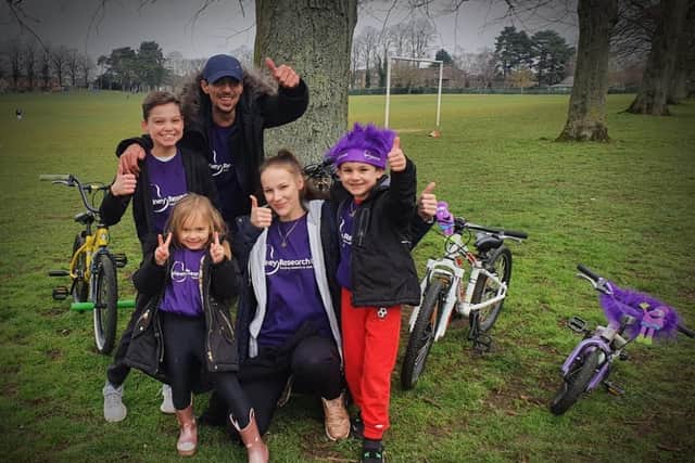Logan (right) with his mum, dad, sister and cousin as they start to clock up the miles for the challenge.