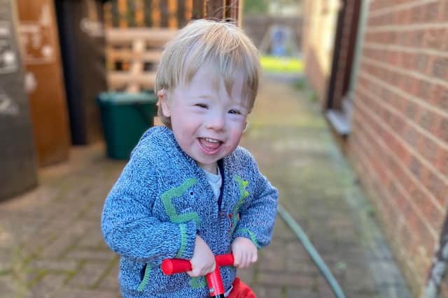 Samuel loves being in the garden and being active.