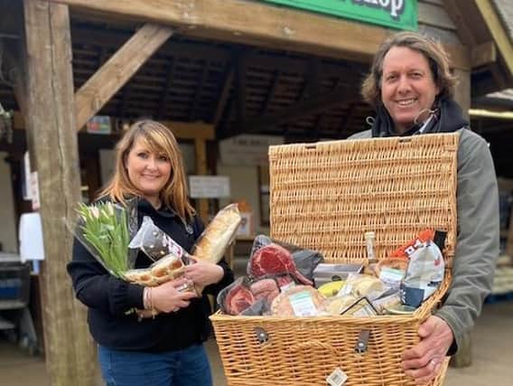Emma from Sauls and Adrian from Smiths Farm Shop with the winning hamper.