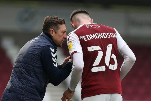 Jon Brady gives some instructions to Ryan Edmondson during Saturday's game against Crewe.