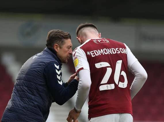 Jon Brady gives some instructions to Ryan Edmondson during Saturday's game against Crewe.
