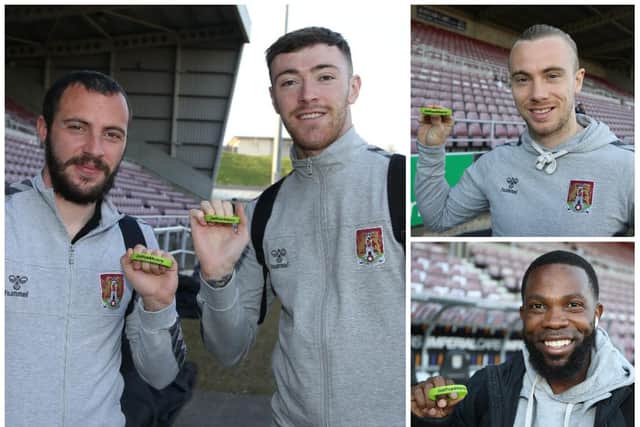 Northampton Town stars Mark Marshall, Joseph Mills, Michael Harriman and Ryan Edmondson showed their support for Cobblers fan Harry before last night's win over Oxford. Photo: Pete Norton