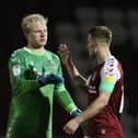 BIG WIN: Bryn Morris and Jonathan Mitchell salute a job well done by the Cobblers on Tuesday. Pictures: Pete Norton.