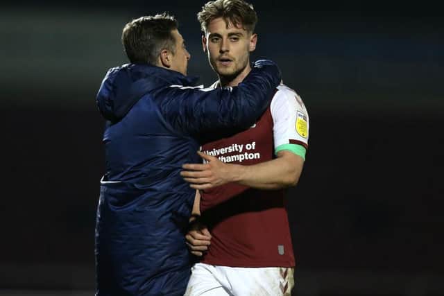 Danny Rose and Jon Brady embrace after Tuesday's victory. Picture: Pete Norton.