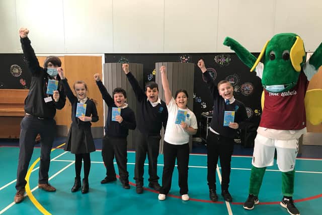 Stimpson Avenue Academy hosted a visit from Northampton Town Football Club mascot Clarence the Dragon