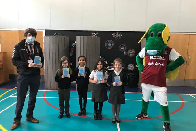 Stimpson Avenue Academy hosted a visit from Northampton Town Football Club mascot Clarence the Dragon