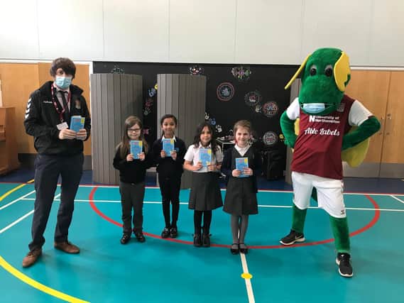 Stimpson Avenue Academy hosted a visit from Northampton Town Football Club mascot Clarence the Dragon