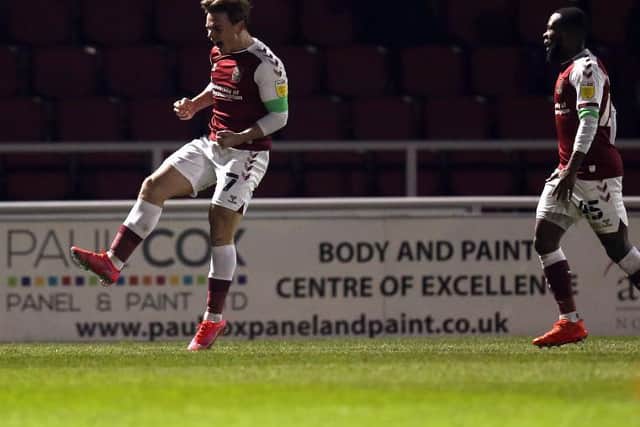 Sam Hoskins celebrates his goal.
