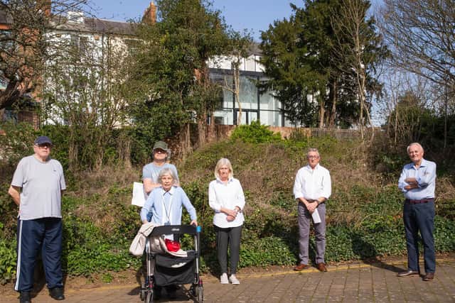 David (far right) and the Scholars Court residents standing behind the Mackintosh house