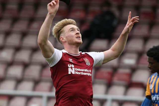 Ryan Watson celebrates his first-half goal for the Cobblers (Pictures: Pete Norton)