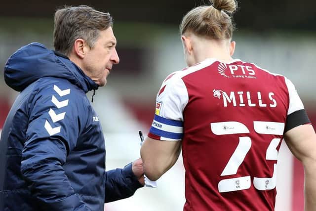 Jon Brady gets a message across to Joseph Mills during the Cobblers' Good Friday win over Shrewsbury Town (Picture: Pete Norton)