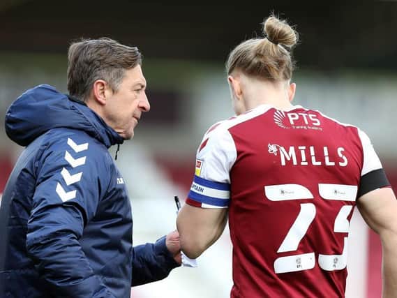 Jon Brady gets a message across to Joseph Mills during the Cobblers' Good Friday win over Shrewsbury Town (Picture: Pete Norton)