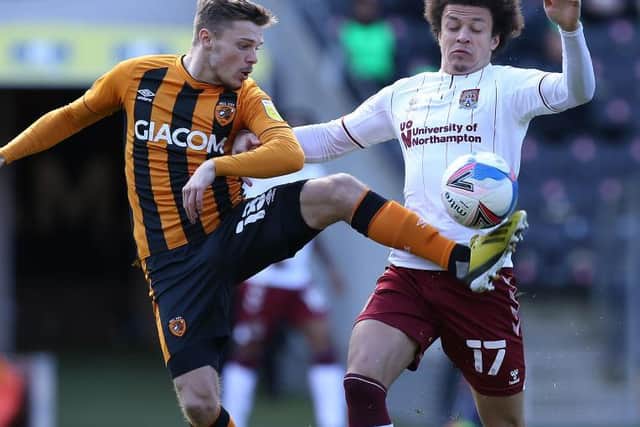 Shaun McWilliams and Alfie Jones challenge for the ball. Pictures: Pete Norton.