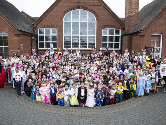 The entire school posed for their photograph in the playground today as they took a trip down the rabbit hole and into wonderland. Pictures by Kirsty Edmonds.