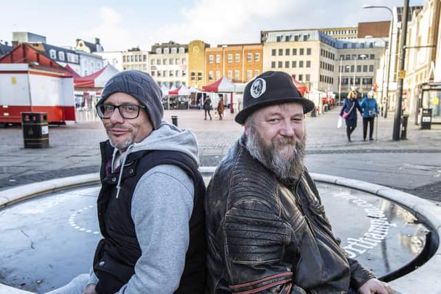 Charity trustee Simon Rash pictured with volunteer Bill Boorman in Northampton's Market Square. Picture by Kirsty Edmonds.