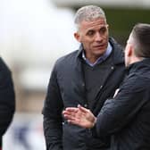 Keith Curle talks to the fourth official during Saturday's game.