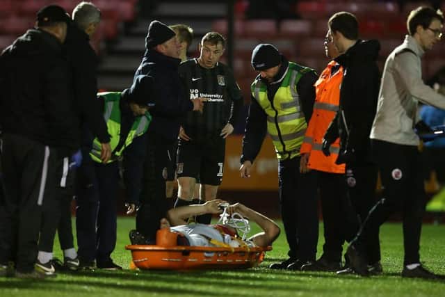 Harry Smith was given oxygen and had to be stretchered from the field at Crawley, prompting fears he'd miss the rest of the season.