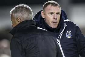 Graham Coughlan, during his time in charge of Bristol Rovers, and Keith Curle