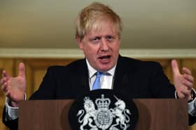 PM Boris Johnson speaks and takes questions during a press conference in Downing Street regarding the coronavirus outbreak, on March 9. (Getty Images).