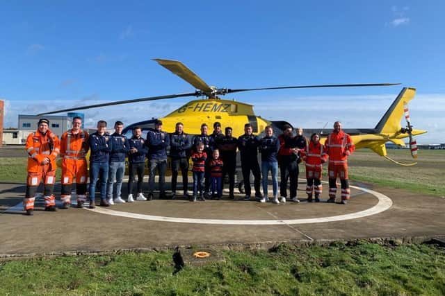 Members of Old Northamptonians rugby club met air ambulance staff after raising money to thank them.