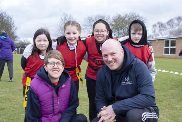 Headteacher Rebecca Payne and assistant head Andy Elyard with some of the children who took part. Photo: Kirsty Edmonds.