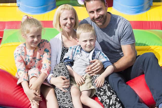 A fun day at the Squirrels pub in Duston two years ago raised more than 2,300 for then five-year-old Harry before his operation. He is pictured with his sister Amelia, mum Jenny and dad Gareth Restall.