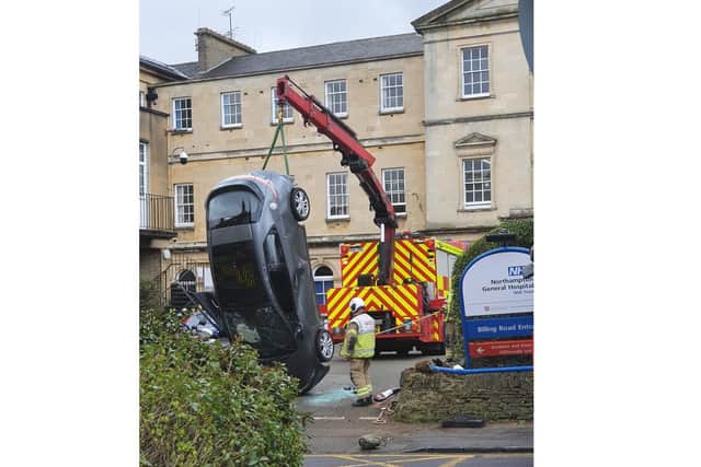 Fire crews attended the scene to lift the car away.