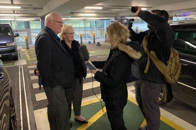 The Abels are greeted by Good Morning Britain cameras at Heathrow