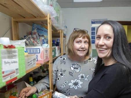 Food bank boss Anne Woodly with volunteer Gemma Carter