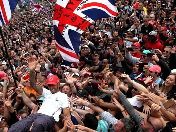 Lewis Hamilton goes crowd surfing after winning the 2019 British Grand Prix at Silverstone