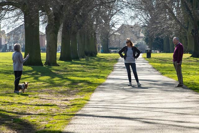 Everyone keeping a safe distance from each other in Abington Park. Photo: Leila Coker