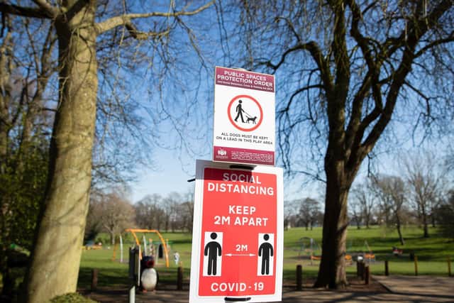 A social distancing sign in Abington Park. Photo: Leila Coker