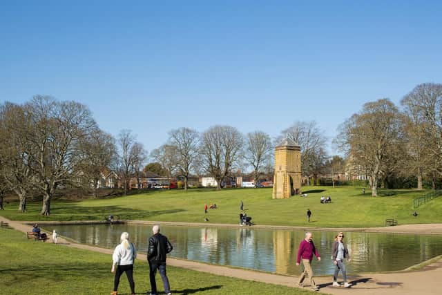 Everyone keeping a safe distance from each other in Abington Park. Photo: Leila Coker