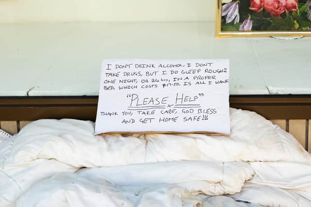 A sign written by a rough sleeper camped in Debenhams doorway this week in the Drapery as he pleaded for help ahead of the announcement today.