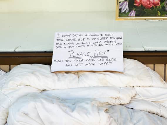 A sign written by a rough sleeper camped in Debenhams doorway this week in the Drapery as he pleaded for help ahead of the announcement today.