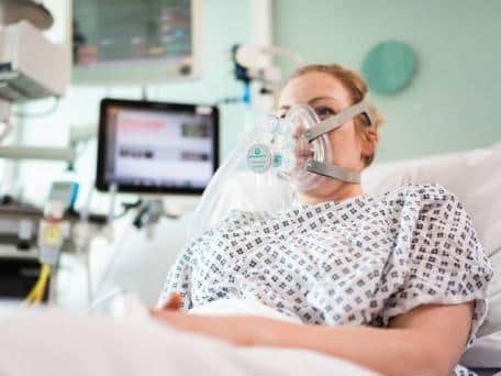 A volunteer patient tests the new breathing aid