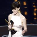 Anne Hathaway accepts the Best Supporting Actress award for Les Miserables onstage during the Oscars in 2013. Picture: Kevin Winter/Getty Images