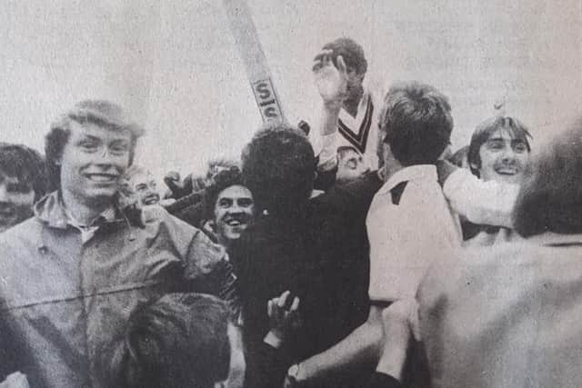 Jim Griffiths is chaired off the field by jubilant Northants supporters