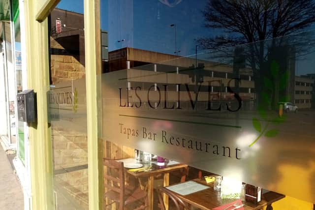Immigration officers executed a warrant at the Les Olives restaurant in December, but the restaurant is disputing claims it employed illegal workers in its kitchen.