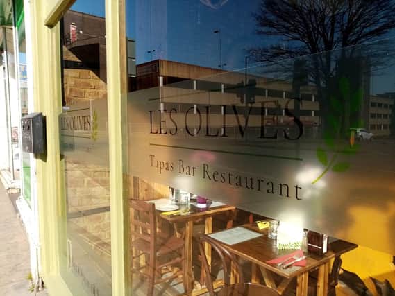 Immigration officers executed a warrant at the Les Olives restaurant in December, but the restaurant is disputing claims it employed illegal workers in its kitchen.