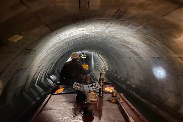 Canal and River Trust engineers inspect Blisworth Tunnel aboard Sculptor