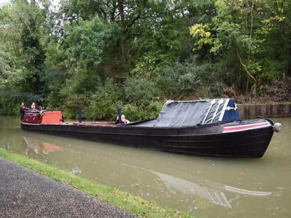 Canal boat Sculptor was built in 1935 and is moored outside the Canal Museum at Stoke Bruerne. Photo: Canal and River Trust