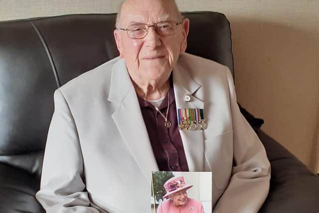 Gordon with his card from The Queen.