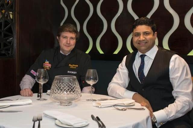 Saffron managing director, Naz Islam (right), with Northampton South MP, Andrew Lewer (left), who has written to the restaurant staff thanking them for their efforts in supporting emergency services during the coronavirus outbreak.