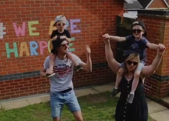 The video captures families singing and dancing to a well-known song.