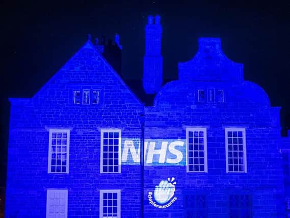 Delapre Abbey made a spectacular sight lit up in NHS blue